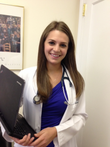 Picture of female nurse holding laptop
